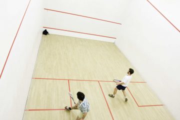 why do squash players touch the wall