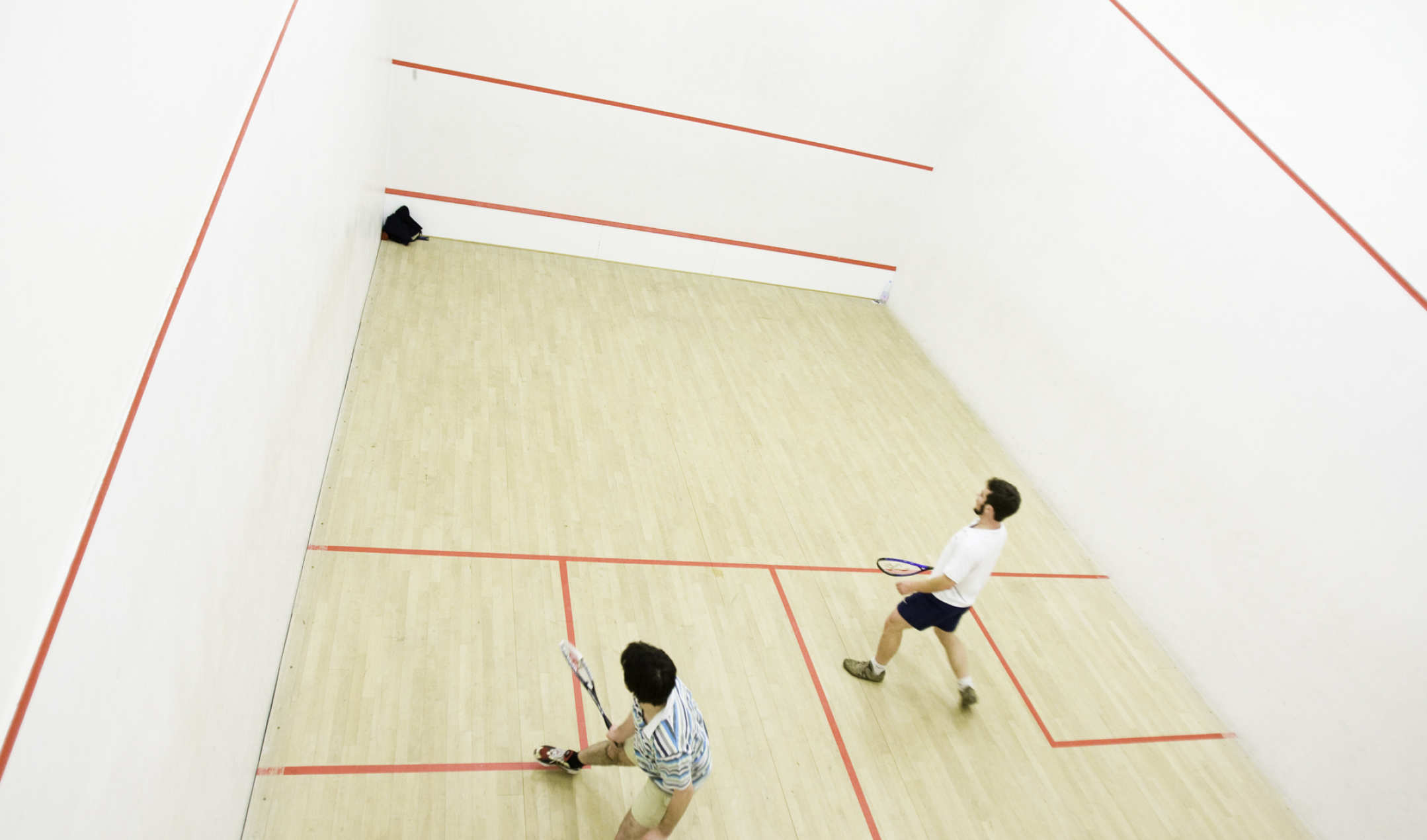 why do squash players touch the wall